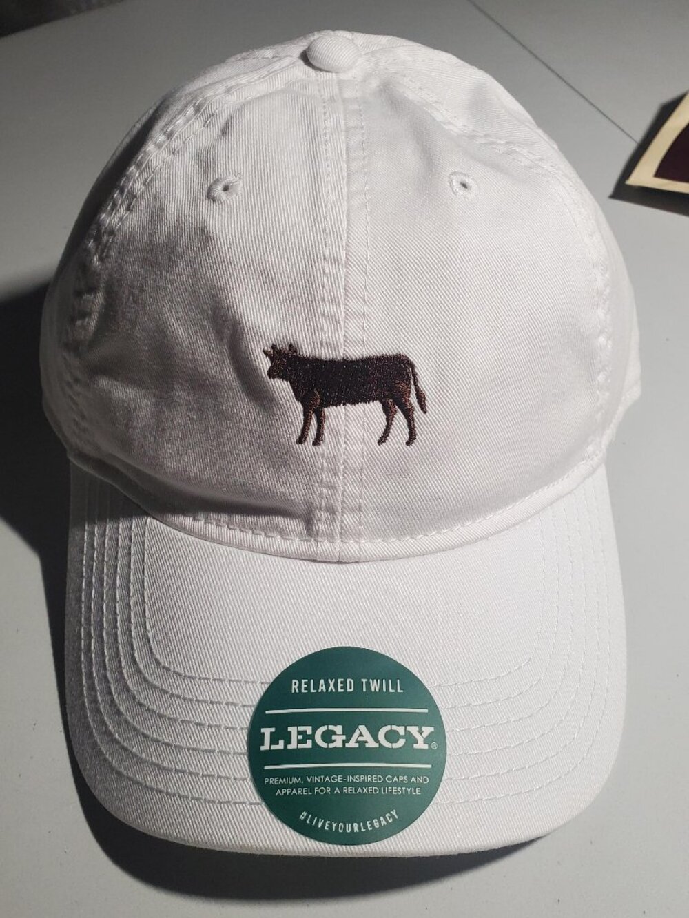 Legacy white hat with embroidered Cow from Peter Luger's NWT